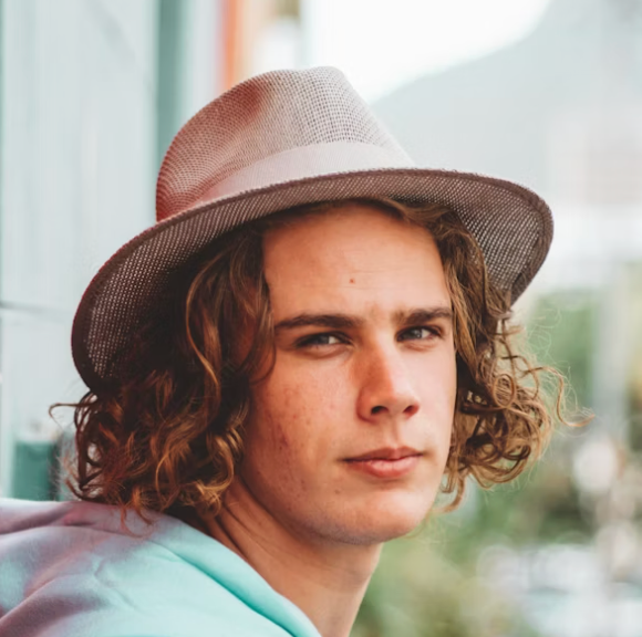 Man wearing fedora hat.